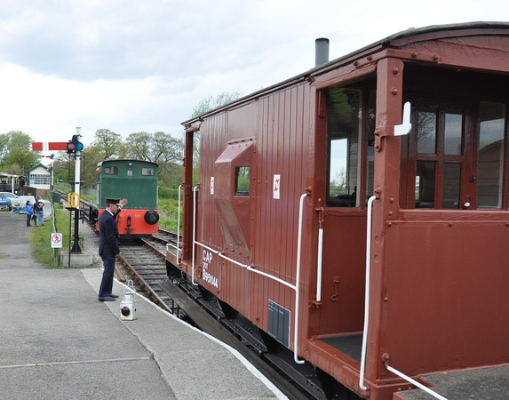 The gaurd signals the ruston 165 on to the train 2012